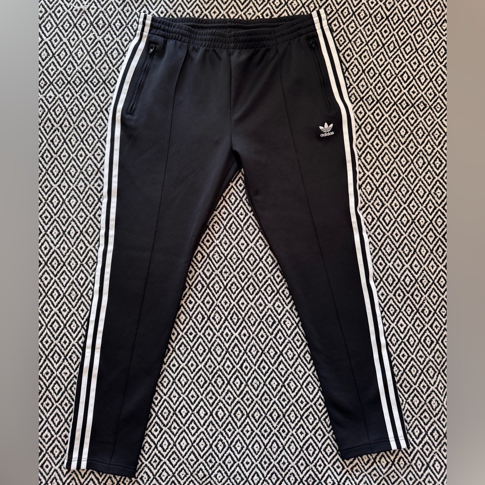 Adidas, size L women’s track pants, black & white stripes.